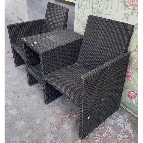 87 - A plastic rattan effect two seater garden bench with central two tier table - approx. 85cm high x 14... 