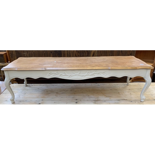 90 - A French style cream painted walnut rectangular coffee table on cabriole supports - approx. 41cm hig... 