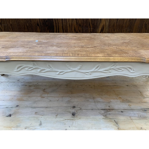 90 - A French style cream painted walnut rectangular coffee table on cabriole supports - approx. 41cm hig... 