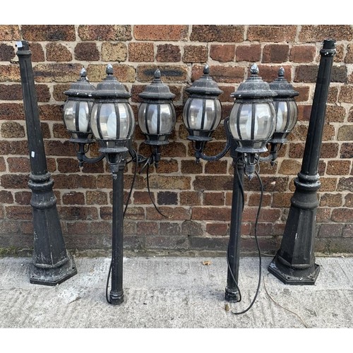 42 - A pair of Victorian style cast metal three branch garden/street lanterns - approx. 215cm high