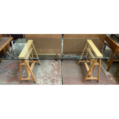 72 - A Habitat glass top and beech adjustable trestle office desk - approx. 73cm high x 200cm wide x 90cm... 