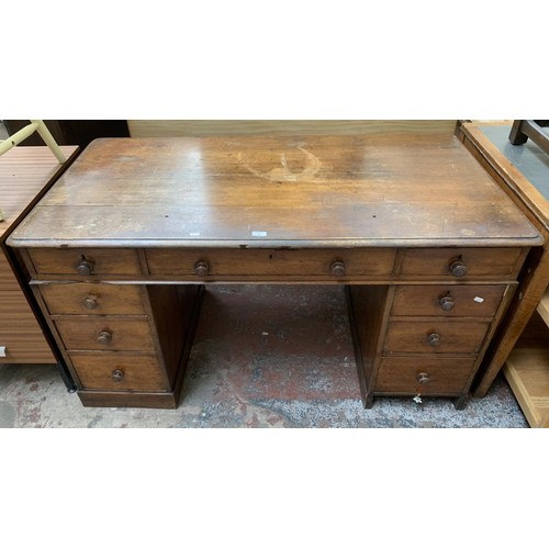 100 - A Victorian oak twin pedestal writing desk - approx. 75cm high x 142cm wide x 76cm deep