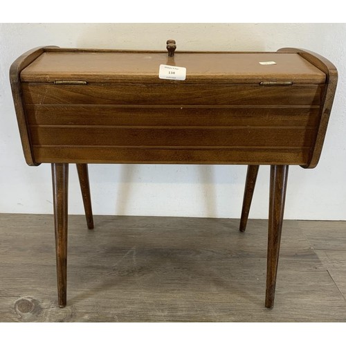 138 - A mid 20th century walnut sewing box on tapered supports - approx. 45cm high x 46.5cm wide x 27cm de... 