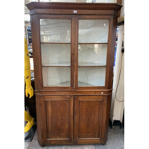 216 - A George III oak flat front free standing corner cabinet - approx. 187cm high x 110cm wide x 64cm de... 