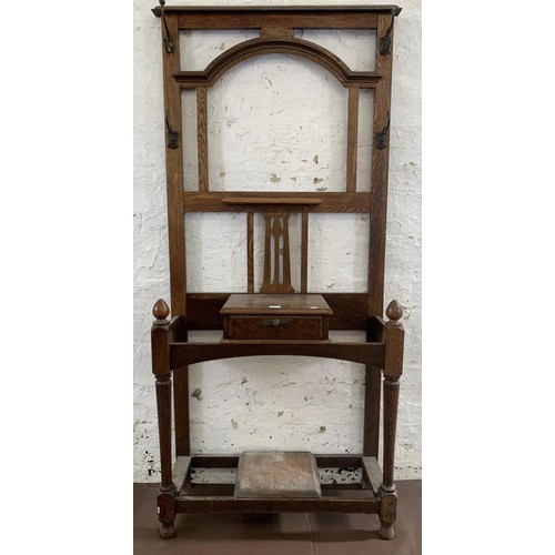 3 - An early 20th century oak hall stand - approx. 188cm high x 83cm wide x 32cm deep