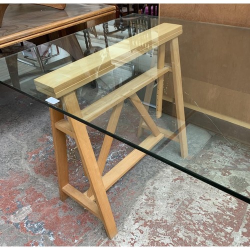 72 - A Habitat glass top and beech adjustable trestle office desk - approx. 73cm high x 200cm wide x 90cm... 