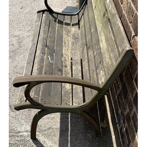 144 - A wrought iron and wooden slatted garden bench - approx. 78.5cm high x 128cm wide x 51cm deep