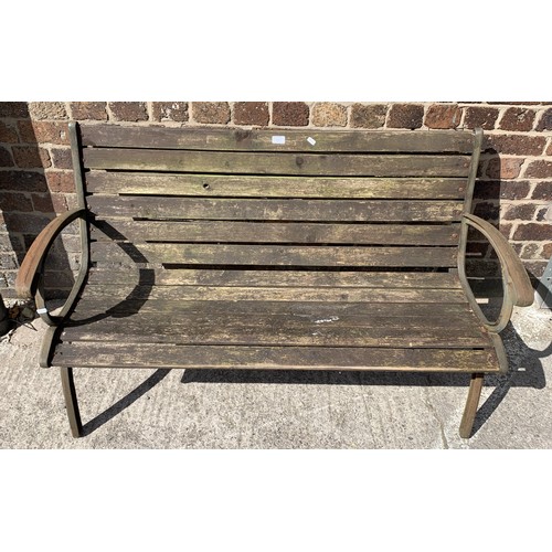 144 - A wrought iron and wooden slatted garden bench - approx. 78.5cm high x 128cm wide x 51cm deep