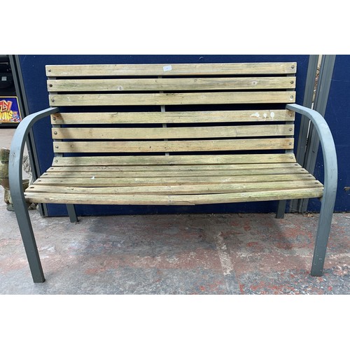 145 - A metal and wooden slatted garden bench - approx. 82cm high x 119.5cm wide x 47.5cm deep