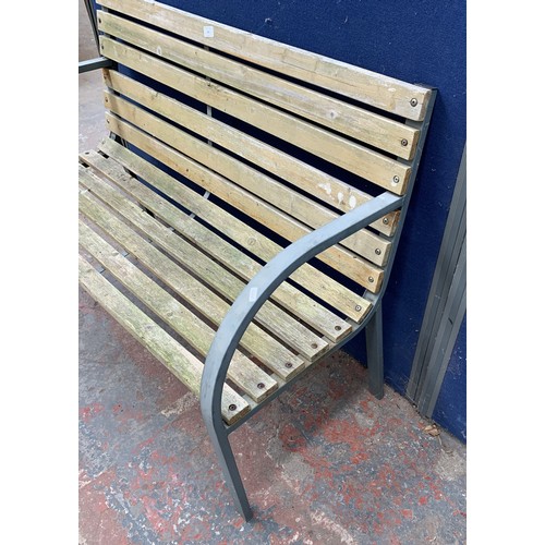 145 - A metal and wooden slatted garden bench - approx. 82cm high x 119.5cm wide x 47.5cm deep