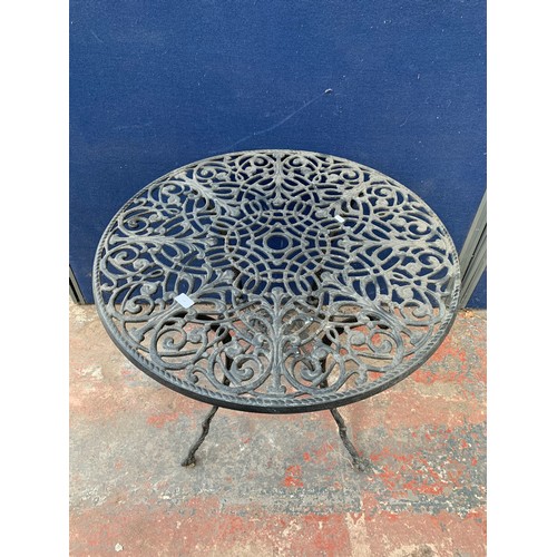 148 - A 19th century style cast aluminium and black painted circular patio table - approx. 68.5cm high x 8... 