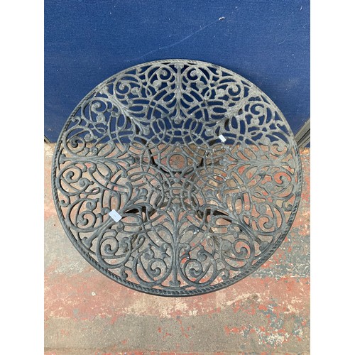 148 - A 19th century style cast aluminium and black painted circular patio table - approx. 68.5cm high x 8... 