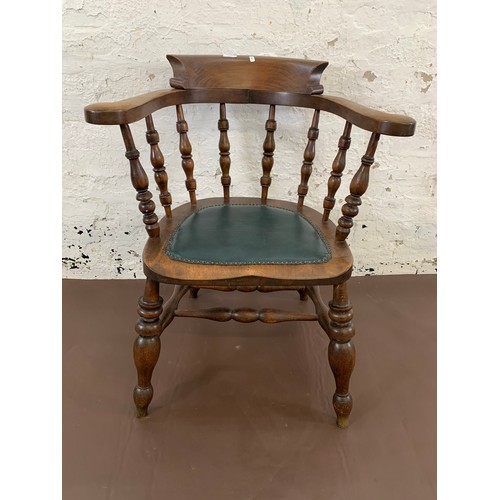 150 - A 19th century elm and mahogany bow back smokers armchair with green vinyl and brass studded seat pa... 