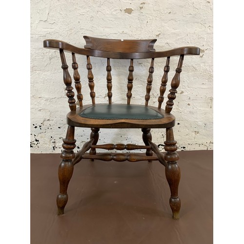 150 - A 19th century elm and mahogany bow back smokers armchair with green vinyl and brass studded seat pa... 