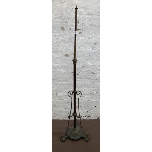 38 - An Arts & Crafts copper telescopic standard lamp on footed base - approx. 147cm high