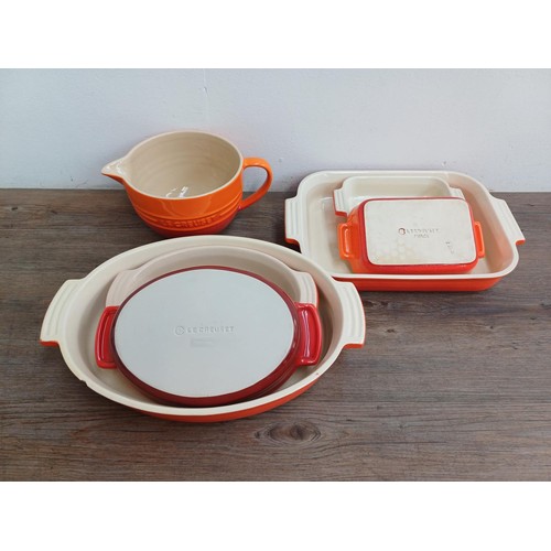 935 - Seven items of Le Creuset stoneware, one mixing bowl, one large and two small rectangular dishes, on... 