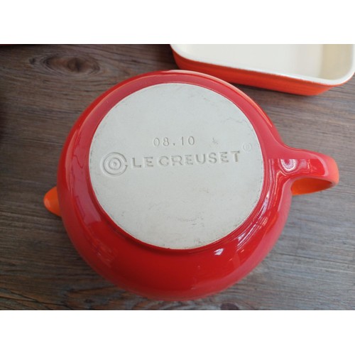 935 - Seven items of Le Creuset stoneware, one mixing bowl, one large and two small rectangular dishes, on... 