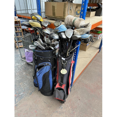 1022 - Three golf bags containing clubs to include Slazenger, Wilson, Hippo, Callaway etc.