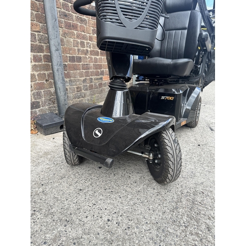 1036 - A Sterling S700 road legal 8mph long range mobility scooter with foldable weather cover