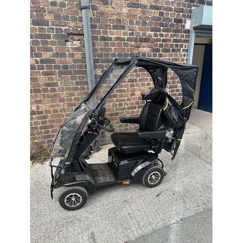 1036 - A Sterling S700 road legal 8mph long range mobility scooter with foldable weather cover