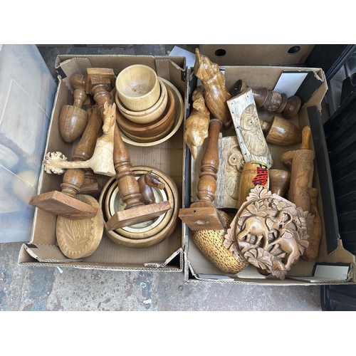 1146 - Three boxes of treenware to include bowls, candlesticks, cat figurines, rolling pins, turned and car... 