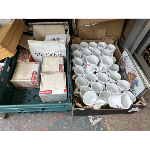 1153 - Six boxes containing approx. 31 Mr. Blobby mugs, seven sealed Pilkington's glazed universal tiles co... 