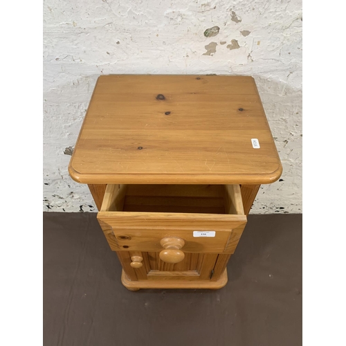 156 - A modern solid pine bedside cabinet - approx. 69cm high x 38cm wide x 31cm deep