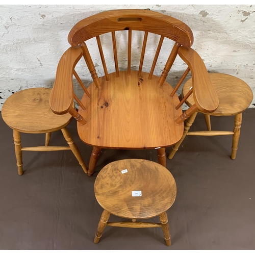 158 - Four pieces of furniture, three elm stools - approx. 44.5cm high and one pine spindle back desk chai... 