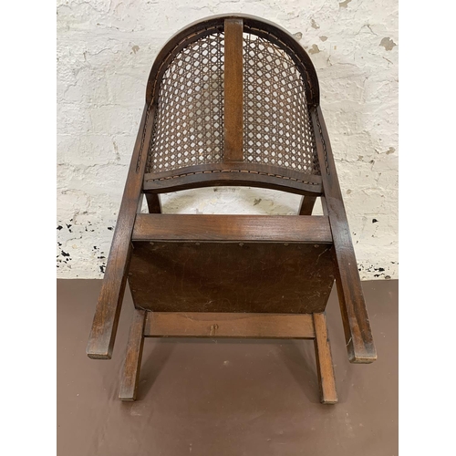 171 - A vintage oak Bergere armchair - approx. 69cm high x 53cm wide x 39cm deep