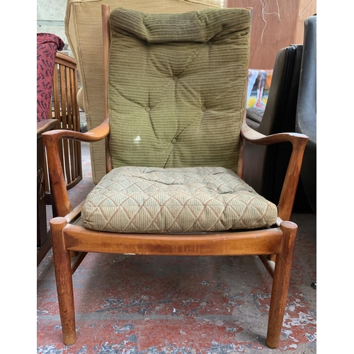 174 - A 1970s Parker-Knoll PK 1016/7/8/9 teak and green upholstered armchair - approx. 96cm high x 65cm wi... 