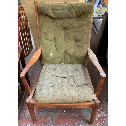 174 - A 1970s Parker-Knoll PK 1016/7/8/9 teak and green upholstered armchair - approx. 96cm high x 65cm wi... 