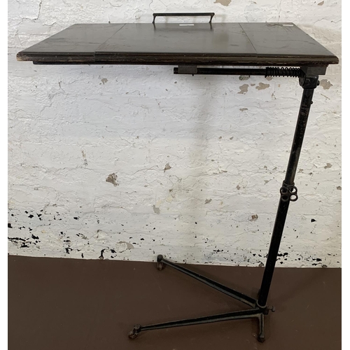 176 - A vintage black painted cast metal and mahogany height adjustable and tilting reading table - approx... 