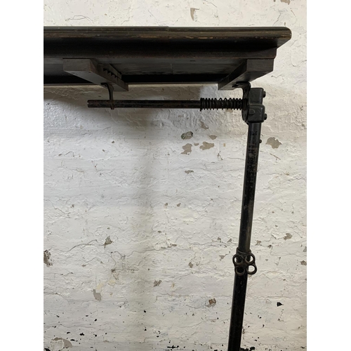 176 - A vintage black painted cast metal and mahogany height adjustable and tilting reading table - approx... 