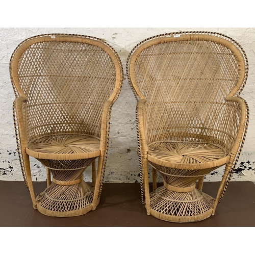 178 - A pair of mid 20th century wicker peacock chairs - approx. 104cm high x 66cm wide