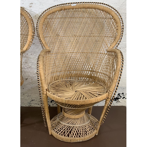 178 - A pair of mid 20th century wicker peacock chairs - approx. 104cm high x 66cm wide