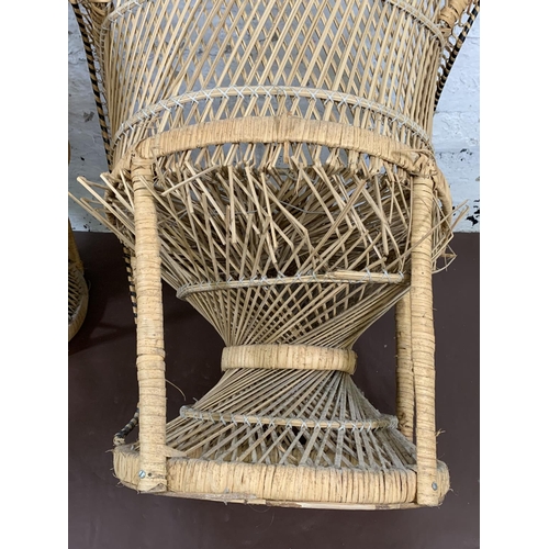 178 - A pair of mid 20th century wicker peacock chairs - approx. 104cm high x 66cm wide