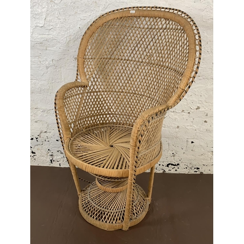 178 - A pair of mid 20th century wicker peacock chairs - approx. 104cm high x 66cm wide