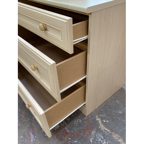 182 - Three pieces of furniture, two beech effect chests of three drawers - largest approx. 76cm high x 80... 