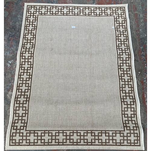 185 - A modern brown and cream rug