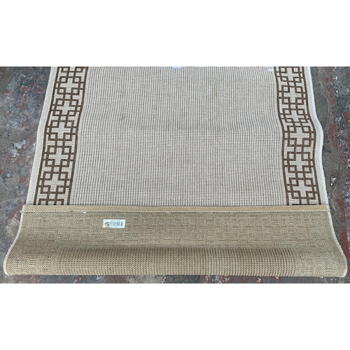 185 - A modern brown and cream rug