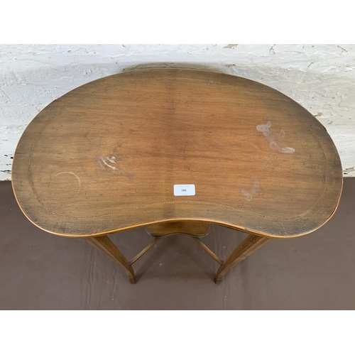 186 - An Edwardian inlaid mahogany kidney shaped two tier side table - approx. 71cm high x 62cm wide x 34.... 