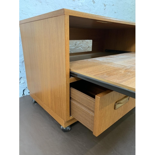 187 - A 1970s G Plan Fresco teak television stand with lower drawer and on castor supports - approx. 53cm ... 