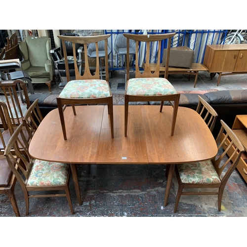 188 - A mid 20th century teak extending dining table with six G Plan Brasilia teak and upholstered dining ... 