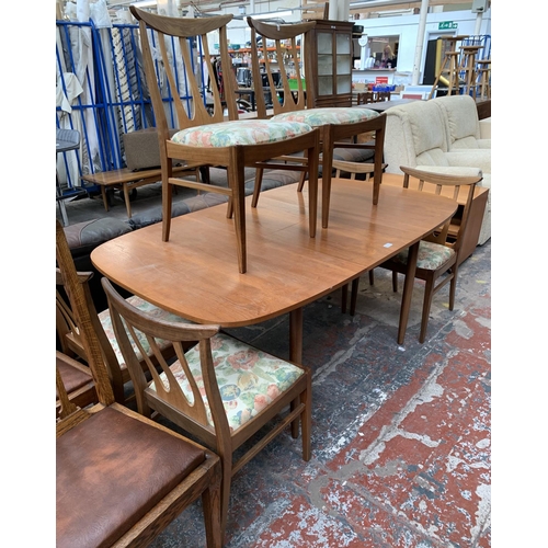 188 - A mid 20th century teak extending dining table with six G Plan Brasilia teak and upholstered dining ... 