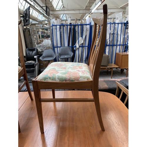 188 - A mid 20th century teak extending dining table with six G Plan Brasilia teak and upholstered dining ... 