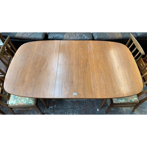 188 - A mid 20th century teak extending dining table with six G Plan Brasilia teak and upholstered dining ... 