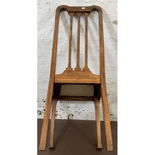 189 - Four early 20th century oak and brown vinyl dining chairs - approx. 105cm high x 45cm wide x 44cm de... 