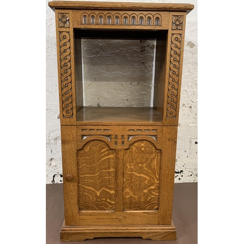 194 - A carved oak single door cabinet - approx. 84cm high x 44cm wide x 41cm deep