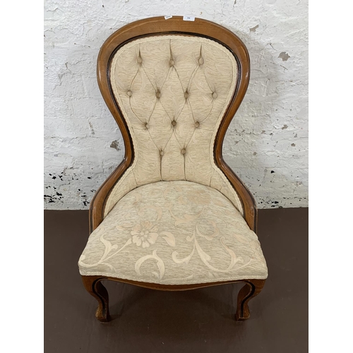 196 - A Victorian style mahogany and cream upholstered balloon back nursing chair - approx. 90cm high x 57... 