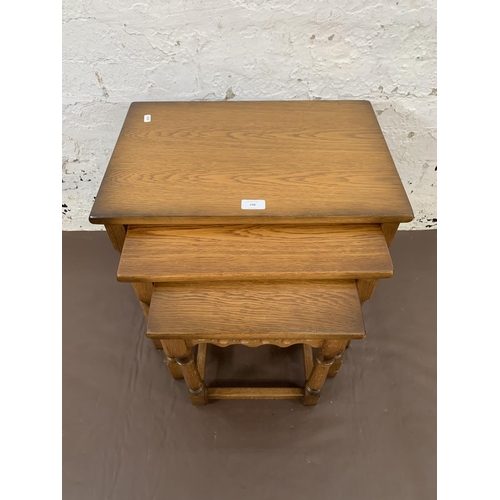 198 - An oak nest of three tables - approx. 48cm high x 50.5cm wide x 35cm deep